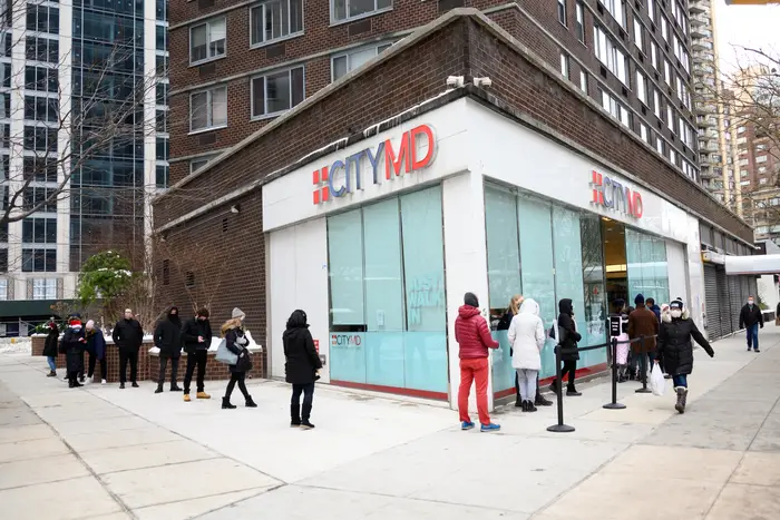 People stand in line outside CityMD on the Upper West Side as the city continues the re-opening efforts following restrictions imposed to slow the spread of coronavirus on Dec. 19, 2020 in New York City.